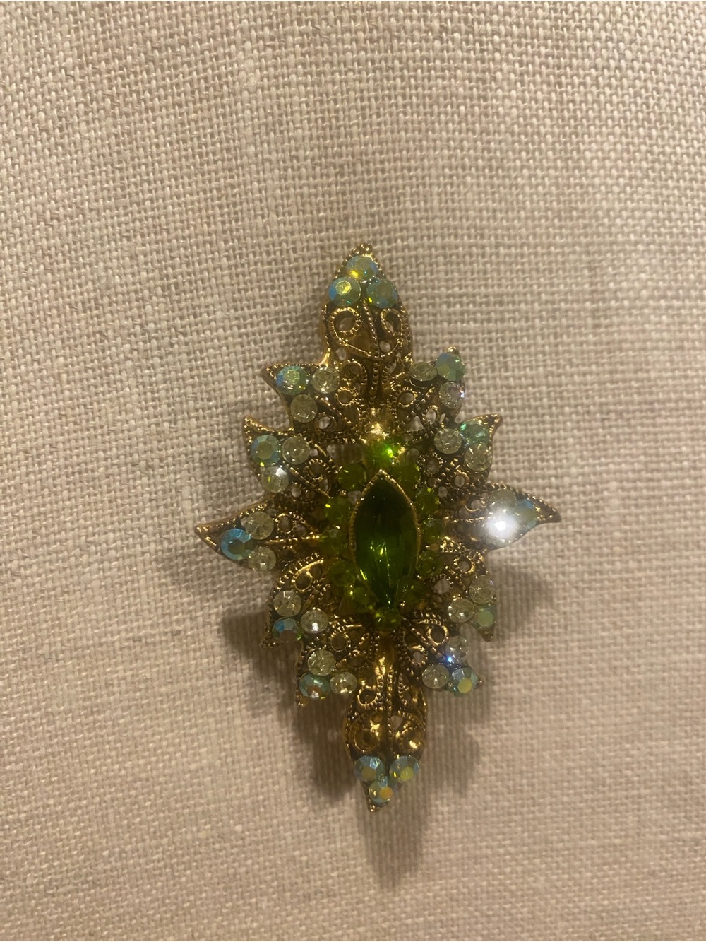 Gold-Tone Brooch with Green and Iridescent Stones